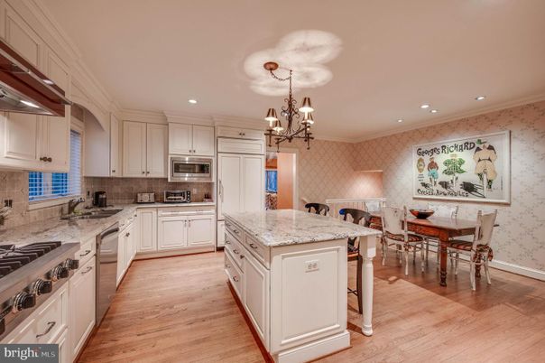 Chandelier, Dining room, Interior, Kitchen, Recessed Lighting, Stainless Steel Appliances, Wood Texture Flooring