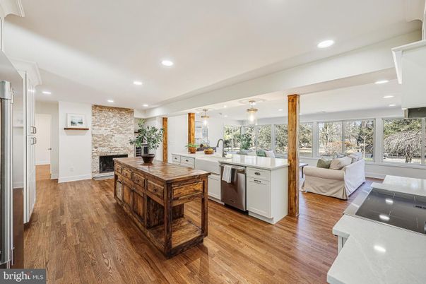 Fireplace, Interior, Kitchen, Living room, Pendant Lights, Recessed Lighting, Stainless Steel Appliances, Stone Walls, Wood Texture Flooring