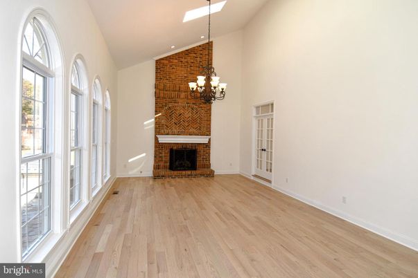 Chandelier, Empty room, Fireplace, Interior, Recessed Lighting, Wood Texture Flooring
