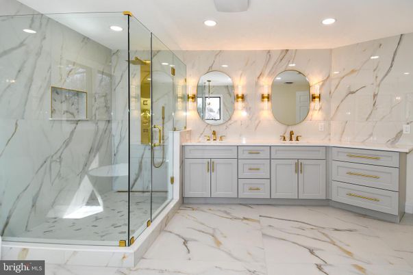 Bathroom, Dual Sink Vanities, Glass Shower, Interior, Marble, Marble Walls, Recessed Lighting