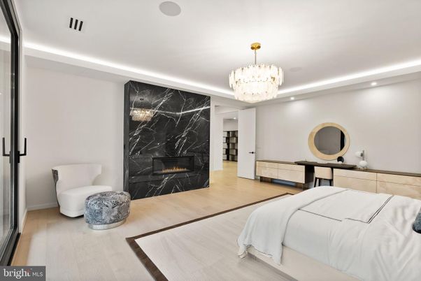 Bedroom, Chandelier, Fireplace, Interior, Marble Walls, Recessed Lighting, Wood Texture Flooring