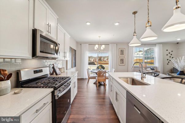 Chandelier, Dining room, Interior, Kitchen, Pendant Lights, Recessed Lighting, Stainless Steel Appliances, Wood Texture Flooring