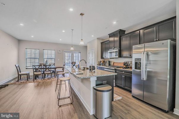 Dining room, Interior, Kitchen, Pendant Lights, Recessed Lighting, Stainless Steel Appliances, Wood Texture Flooring