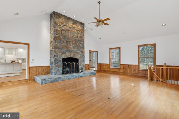 Empty room, Fireplace, Interior, Recessed Lighting, Stone Walls, Wood Texture Flooring