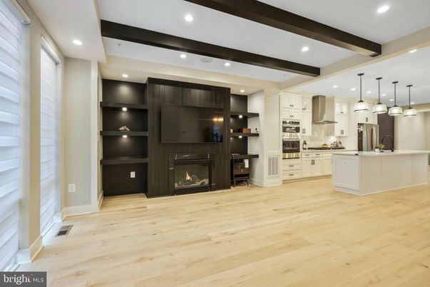 Fireplace, Interior, Kitchen, Pendant Lights, Recessed Lighting, Stainless Steel Appliances, Wooden Beams, Wood Texture Flooring