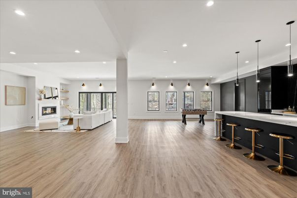 Billiard Table, Fireplace, Game Room, Interior, Living room, Pendant Lights, Recessed Lighting, Wood Texture Flooring