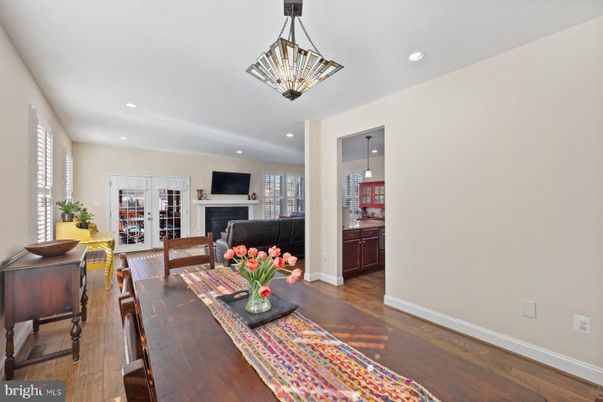 Dining room, Fireplace, Interior, Living room, Pendant Lights, Recessed Lighting, Wood Texture Flooring