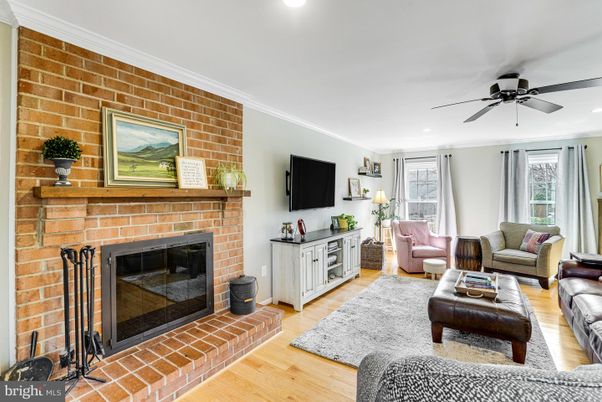 Fireplace, Interior, Living room, Recessed Lighting, Stone Walls, Wood Texture Flooring