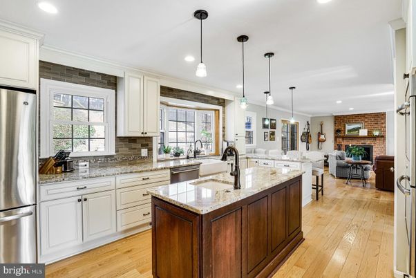 Dining room, Fireplace, Interior, Kitchen, Living room, Pendant Lights, Recessed Lighting, Stainless Steel Appliances, Stone Walls, Wood Texture Flooring