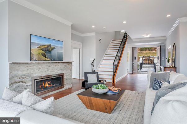 Dining room, Fireplace, Interior, Living room, Recessed Lighting, Wood Texture Flooring