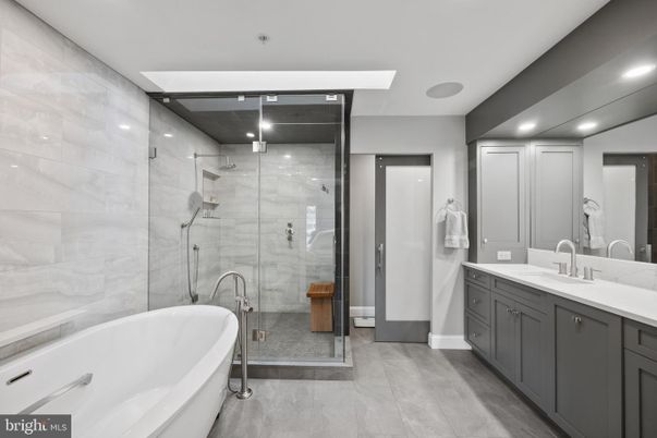 Bathroom, Dual Sink Vanities, Free Standing Baths, Glass Shower, Interior, Marble Walls, Recessed Lighting