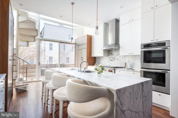 Interior, Kitchen, Marble Walls, Pendant Lights, Recessed Lighting, Stainless Steel Appliances, Wood Texture Flooring