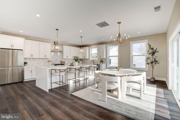 Chandelier, Dining room, Interior, Kitchen, Pendant Lights, Recessed Lighting, Stainless Steel Appliances, Wood Texture Flooring