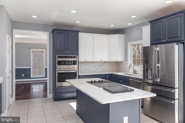 Interior, Kitchen, Marble Walls, Recessed Lighting, Stainless Steel Appliances