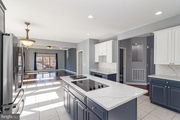 Interior, Kitchen, Marble Walls, Recessed Lighting, Stainless Steel Appliances