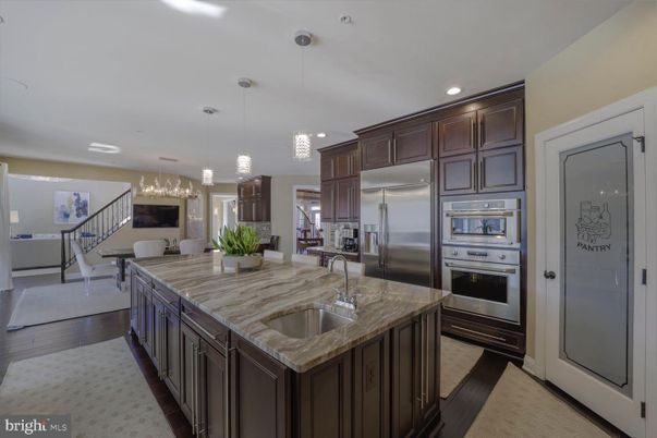 Chandelier, Dining room, Interior, Kitchen, Pendant Lights, Recessed Lighting, Stainless Steel Appliances, Wood Texture Flooring
