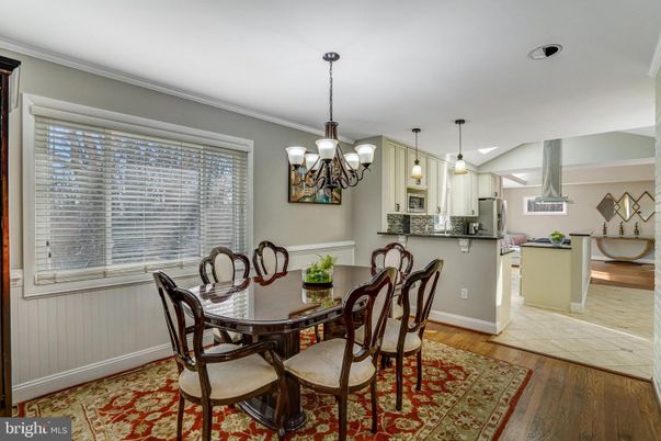 Chandelier, Dining room, Interior, Kitchen, Pendant Lights, Stainless Steel Appliances, Wood Texture Flooring