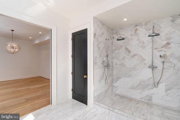 Bathroom, Glass Shower, Interior, Marble, Marble Walls, Pendant Lights, Recessed Lighting, Wood Texture Flooring