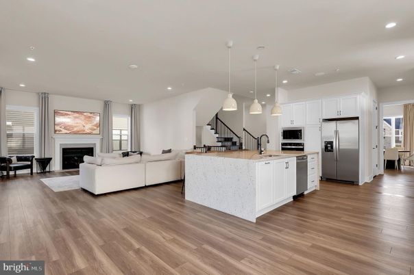 Fireplace, Interior, Kitchen, Living room, Pendant Lights, Recessed Lighting, Stainless Steel Appliances, Wood Texture Flooring