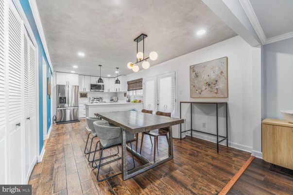 Dining room, Interior, Kitchen, Pendant Lights, Recessed Lighting, Stainless Steel Appliances, Wood Texture Flooring