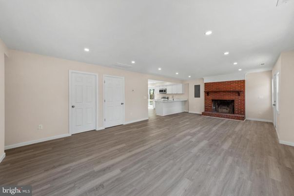 Empty room, Fireplace, Interior, Kitchen, Recessed Lighting, Wood Texture Flooring