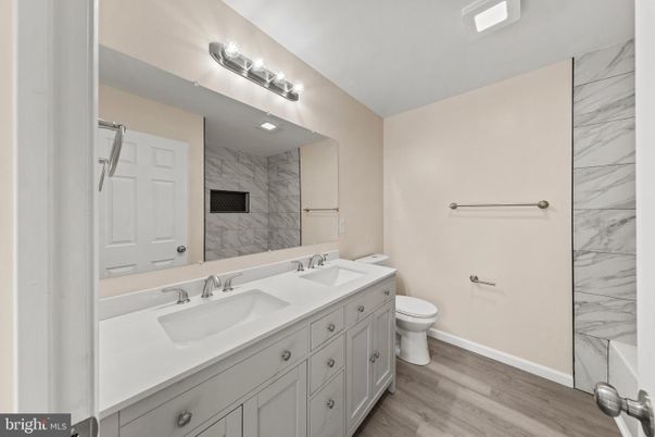 Bathroom, Dual Sink Vanities, Interior, Marble Walls, Wood Texture Flooring