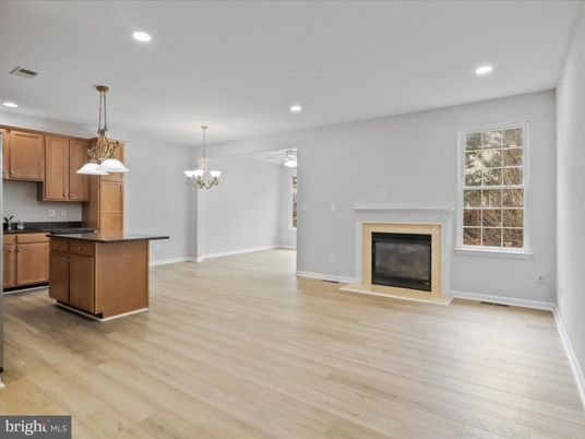 Chandelier, Fireplace, Interior, Kitchen, Pendant Lights, Recessed Lighting, Wood Texture Flooring