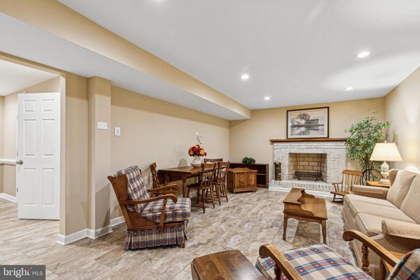 Dining room, Fireplace, Interior, Living room, Recessed Lighting, Stone Walls, Wood Texture Flooring