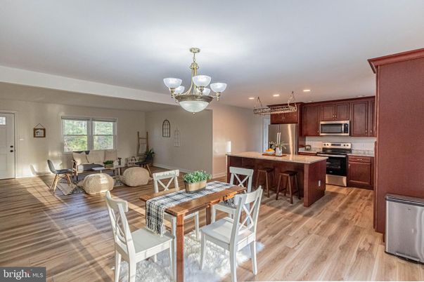 Chandelier, Dining room, Interior, Kitchen, Living room, Recessed Lighting, Stainless Steel Appliances, Wood Texture Flooring