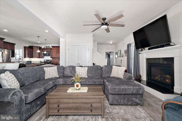 Fireplace, Interior, Kitchen, Living room, Pendant Lights, Recessed Lighting, Stainless Steel Appliances, Wood Texture Flooring