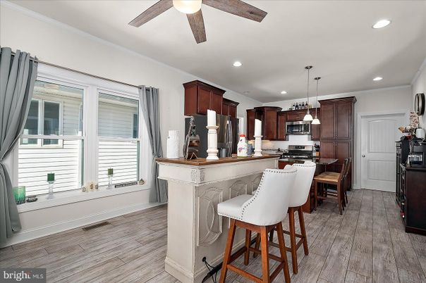 Dining room, Interior, Kitchen, Pendant Lights, Recessed Lighting, Stainless Steel Appliances, Wood Texture Flooring