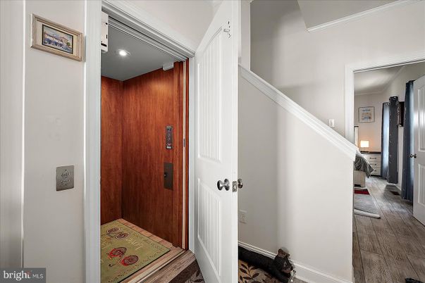 Elevator, Interior, Recessed Lighting, Wood Texture Flooring, Wooden Walls