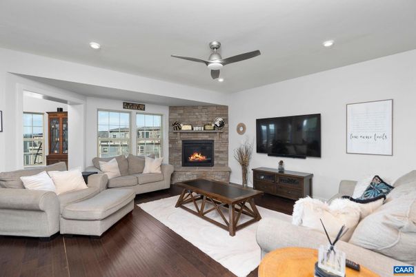 Fireplace, Interior, Living room, Recessed Lighting, Stone Walls, Wood Texture Flooring