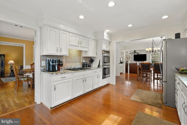 Chandelier, Dining room, Interior, Kitchen, Recessed Lighting, Stainless Steel Appliances, Wood Texture Flooring