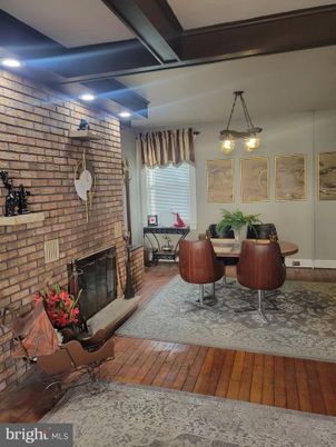 Dining room, Fireplace, Interior, Pendant Lights, Recessed Lighting, Stone Walls, Wood Texture Flooring