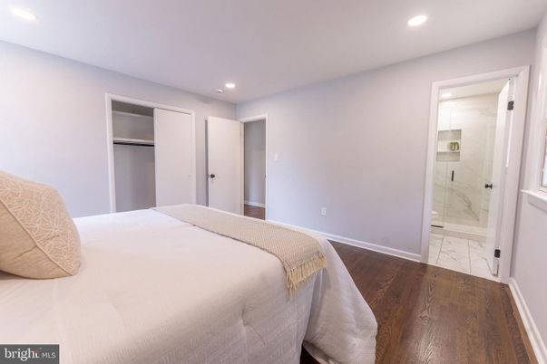 Bathroom, Bedroom, Glass Shower, Interior, Marble, Marble Walls, Recessed Lighting, Wood Texture Flooring
