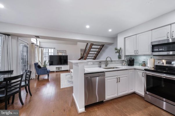 Dining room, Interior, Kitchen, Recessed Lighting, Stainless Steel Appliances, Wood Texture Flooring