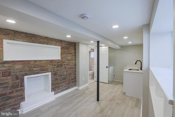 Interior, Recessed Lighting, Stone Walls, Washer, Wood Texture Flooring