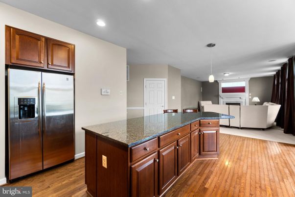Fireplace, Interior, Kitchen, Living room, Pendant Lights, Recessed Lighting, Stainless Steel Appliances, Wood Texture Flooring