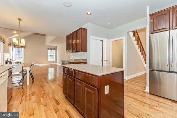 Chandelier, Dining room, Interior, Kitchen, Pendant Lights, Recessed Lighting, Stainless Steel Appliances, Wood Texture Flooring