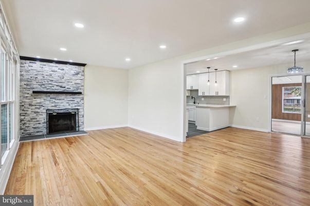 Empty room, Fireplace, Interior, Kitchen, Pendant Lights, Recessed Lighting, Wood Texture Flooring