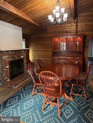 Chandelier, Dining room, Fireplace, Interior, Stone Walls, Wooden Beams, Wooden Ceilings, Wood Texture Flooring, Wooden Walls