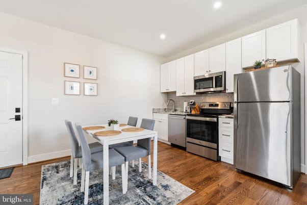 Dining room, Interior, Kitchen, Recessed Lighting, Stainless Steel Appliances, Wood Texture Flooring