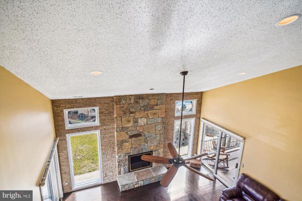 Fireplace, Interior, Recessed Lighting, Stone Walls, Wood Texture Flooring