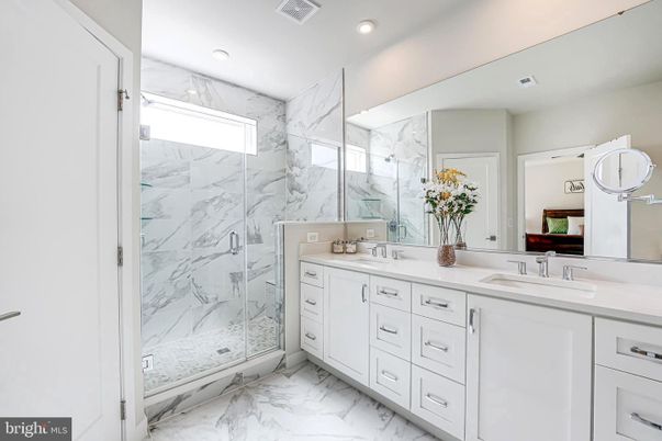 Bathroom, Dual Sink Vanities, Glass Shower, Interior, Marble, Marble Walls, Recessed Lighting