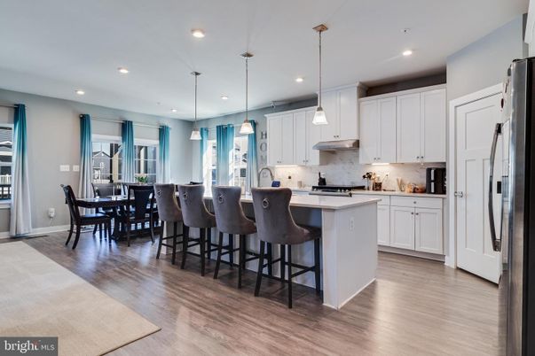 Dining room, Interior, Kitchen, Pendant Lights, Recessed Lighting, Stainless Steel Appliances, Wood Texture Flooring