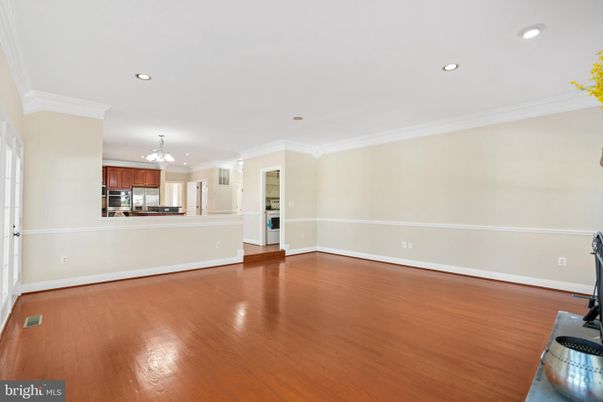 Chandelier, Empty room, Interior, Kitchen, Recessed Lighting, Stainless Steel Appliances, Wood Texture Flooring