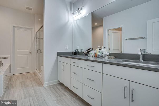 Bathroom, Dual Sink Vanities, Interior, Recessed Lighting, Wood Texture Flooring