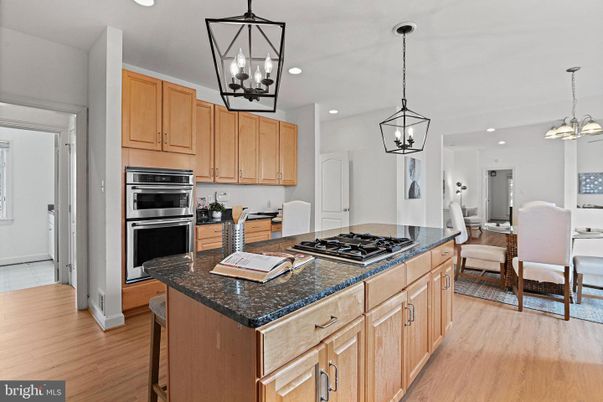 Chandelier, Dining room, Interior, Kitchen, Pendant Lights, Recessed Lighting, Stainless Steel Appliances, Wood Texture Flooring