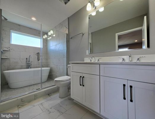 Bathroom, Dual Sink Vanities, Free Standing Baths, Glass Shower, Interior, Marble, Marble Walls, Recessed Lighting